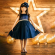 Girl in a blue party dress from UK Flower Girl Boutique