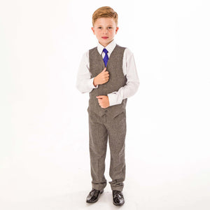 Boy wearing grey tweed trousers and waistcoat from UK Flower Girl Boutique