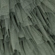 A close-up of sage green tulle fabric with layered ruffles and a fine mesh texture.