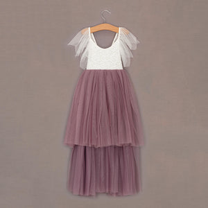 Two-tone dress with white top and heather skirt on a hanger against a brown background
