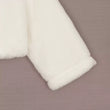 Sleeve of a Girls white faux fur bolero 