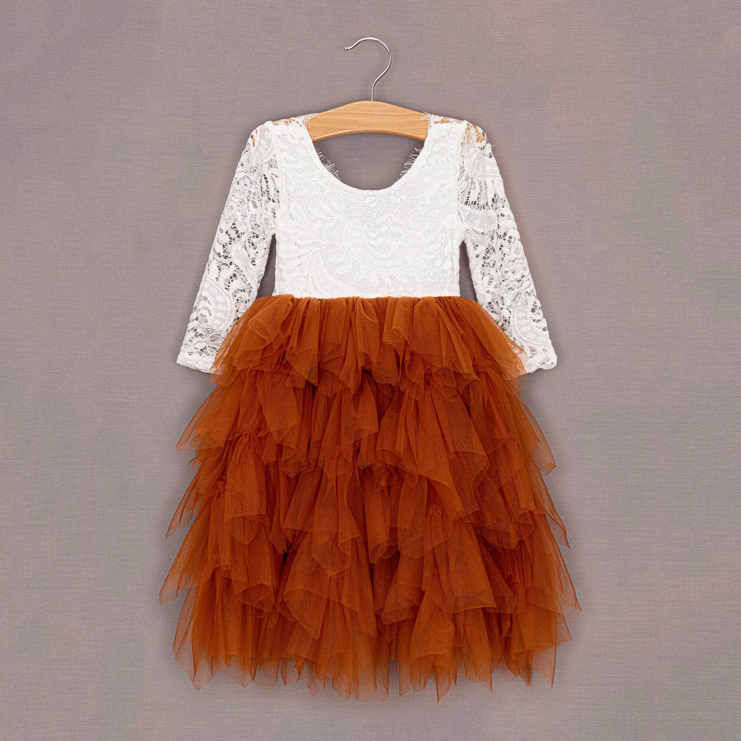 Burnt Orange tulle dress on hanger