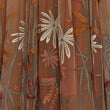 Embroidered fabric with floral patterns on a brown background