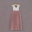 dusty rose tulle dress on hanger 