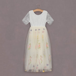 beautiful embroidered fabric dress on hanger