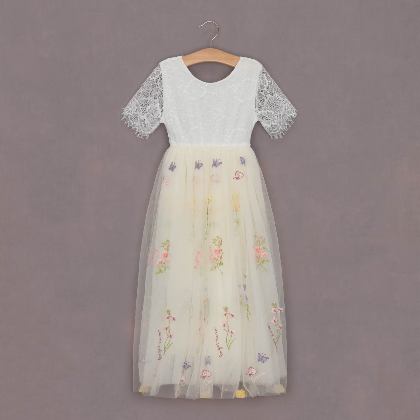 beautiful embroidered fabric dress on hanger