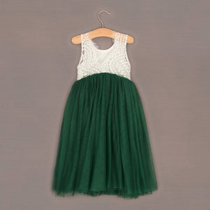 Baby Bohemian Classic Dress - Hunter Green on a hanger against a brown background