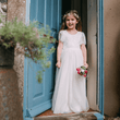 Floor Girl wearing a Flutter Dress in Ivory