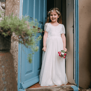 Floor Girl wearing a Flutter Dress in Ivory