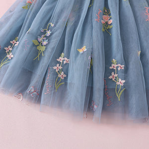 A beautiful lace and tulle flower girl dress in dusty blue