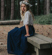 young girl sitting on bench