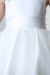 White dress with a belt on a plain background