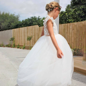 girls in a white tulle dress by uk flower girl boutique