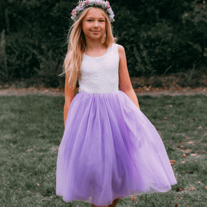 young girl wearing lilac flower girl dress