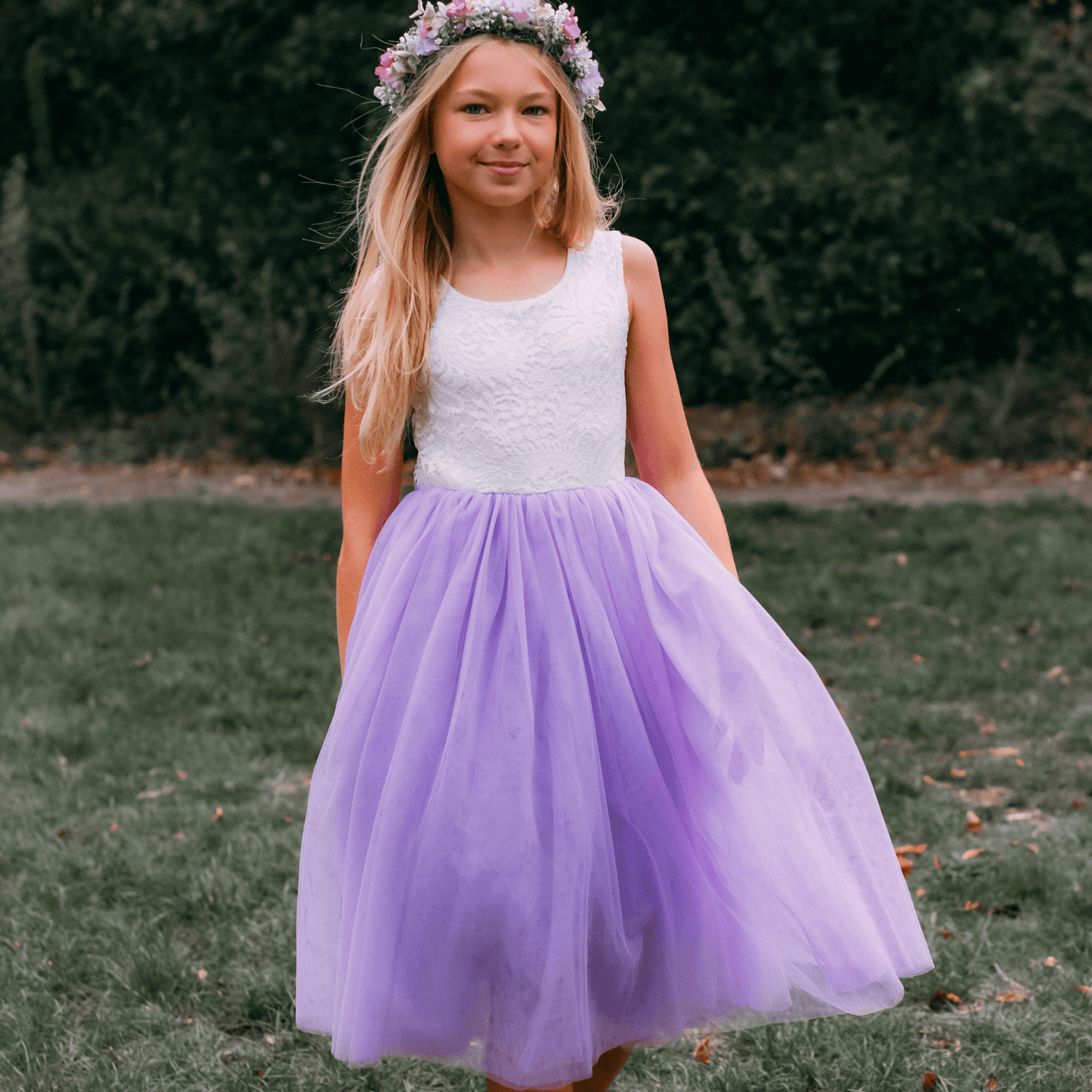 young girl wearing lilac flower girl dress