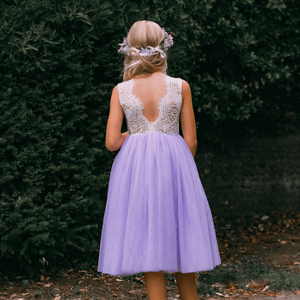 young girl wearing lilac flower girl dress