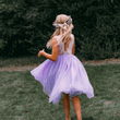 young girl wearing lilac flower girl dress