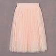 Light pink tulle skirt on a gray background