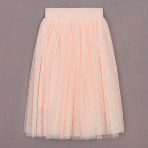 Light pink tulle skirt on a gray background