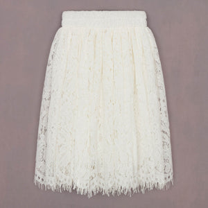 White lace skirt on a grey background
