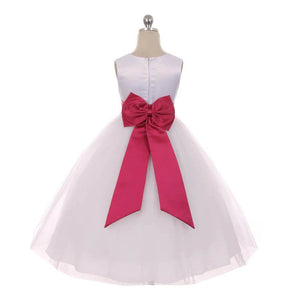 White dress with bright pink bow