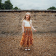 young girl wearing embroidered dress