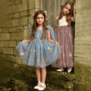 models wearing pretty flower girl dresses