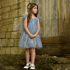 model wearing pretty blue dress from uk flower girl boutique