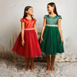 Two girls in red and Green Party dresses