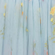 Light blue sheer curtain fabric with delicate yellow floral embroidery and subtle pink accents.