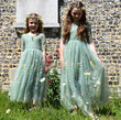 Two young girls in flower girl dresses