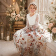young girl wearing her flower girl dress 