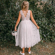 Flower girl in a Beautiful white lace dress