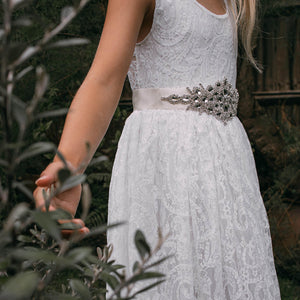 Flower girl in a Beautiful white lace dress