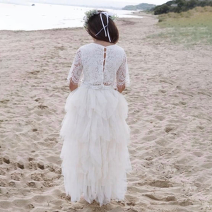 young flower girl on beach