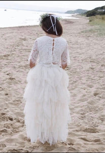young flower girl on beach