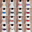 A 4x4 grid showing 16 variations of a white girls' birthday or prom dress with different colored fabric sashes, displayed on black mannequins against a glittery pink background.