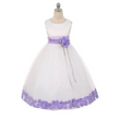 white dress with lilac sash and petal trim