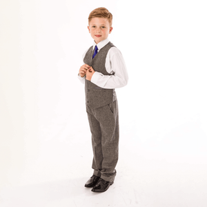 boy modelling tweed trousers and matching waistcoat