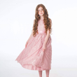 girl twirling in dusky pink dress