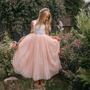 young flower girl in garden