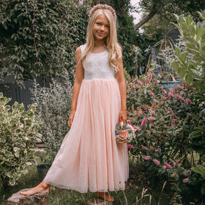 young flower girl in garden