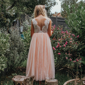 young flower girl in garden