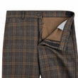 Plaid patterned pants with a close-up of the waistband and pocket on a white background
