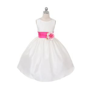 White flower girl dress with a fuscia pink sash