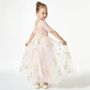 little girl in pink embroidered dress from UK flower Gridl Boutique