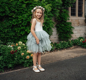 Young girls wearing dress smiing