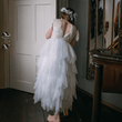 Girl wearing dress and holding flower bouquet