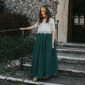 bridesmaid wearing hunter green skirt and lace top