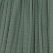 Green tulle fabric with a textured pattern